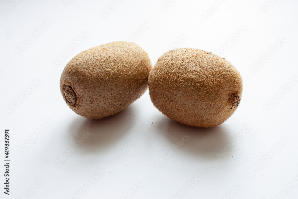 Whole kiwi fruit isolated on white background. Clipping Path. Full depth of field Whole kiwi fruit isolated on white background. Clipping Path. Full depth of field