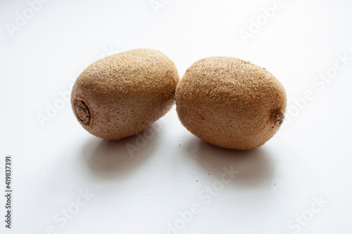 Whole kiwi fruit isolated on white background. Clipping Path. Full depth of field