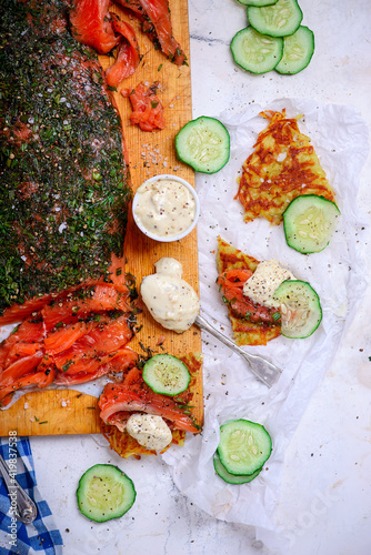 Gravlax on potato pancakes.style rustic photo