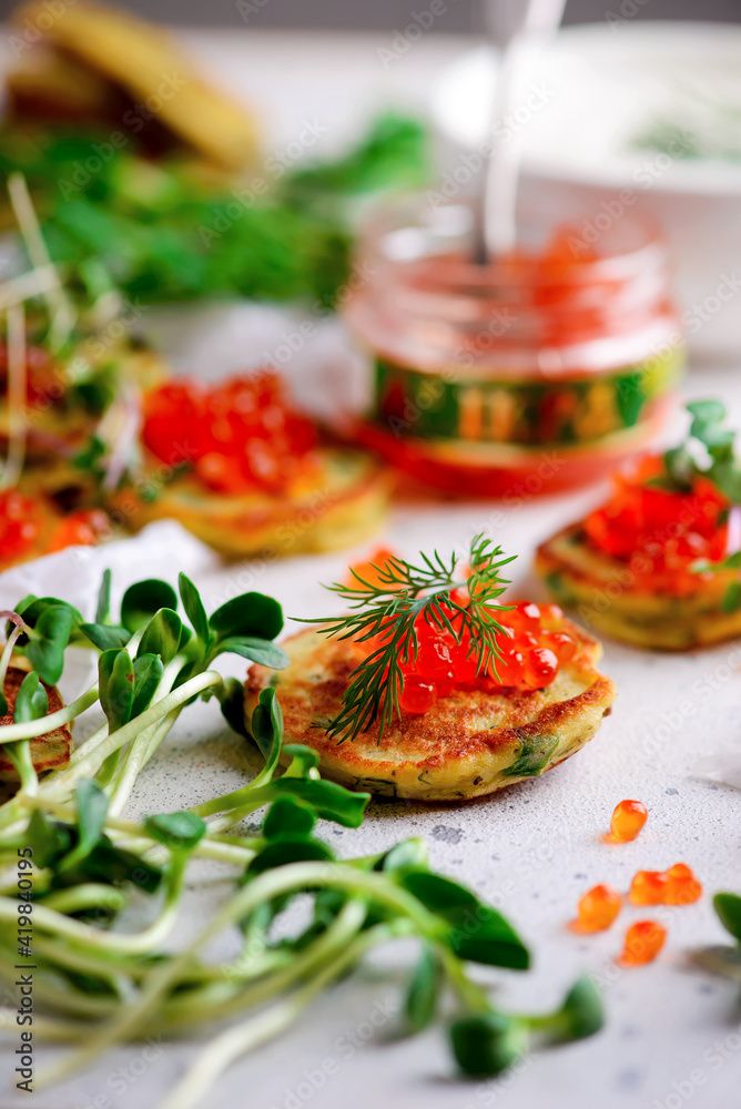 Potato pancakes with caviar.top view.style rustic Potato pancakes with caviar.top view.style rustic