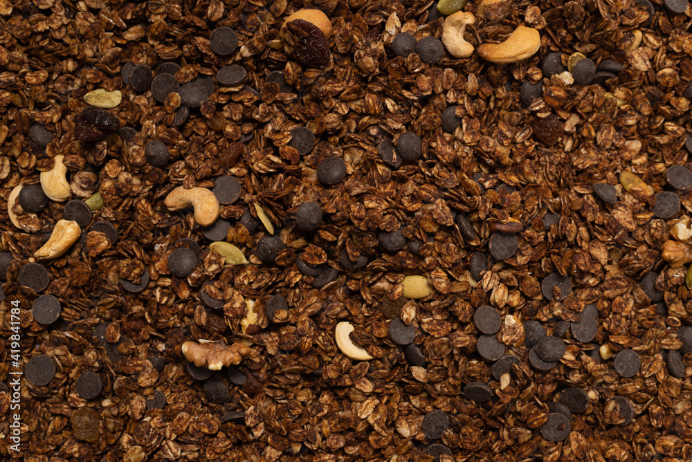 Chocolate granola cereal with nuts background. Chocolate granola cereal with nuts background.