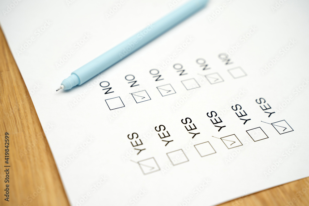 A survey form with yes or no answer options. Questionnaire on white paper, checkboxes ticked