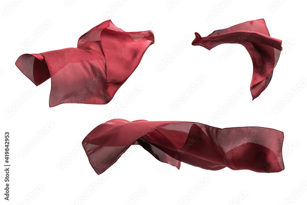 Flowing red silk scarf isolated on white background. Flowing red silk scarf isolated on white background.