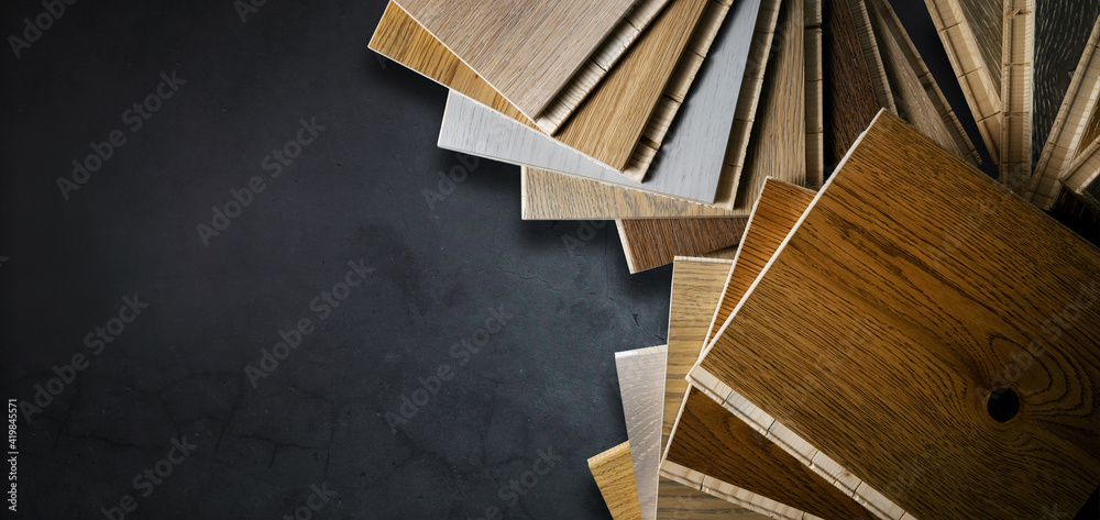 wooden texture flooring material samples on black stone background. banner copy space - obrazy, fototapety, plakaty 