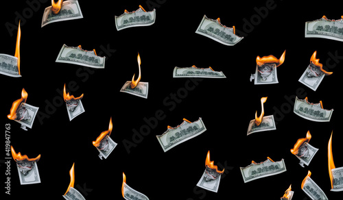 Fotografía Several 100 dollar bills, falling down, burn on a black background