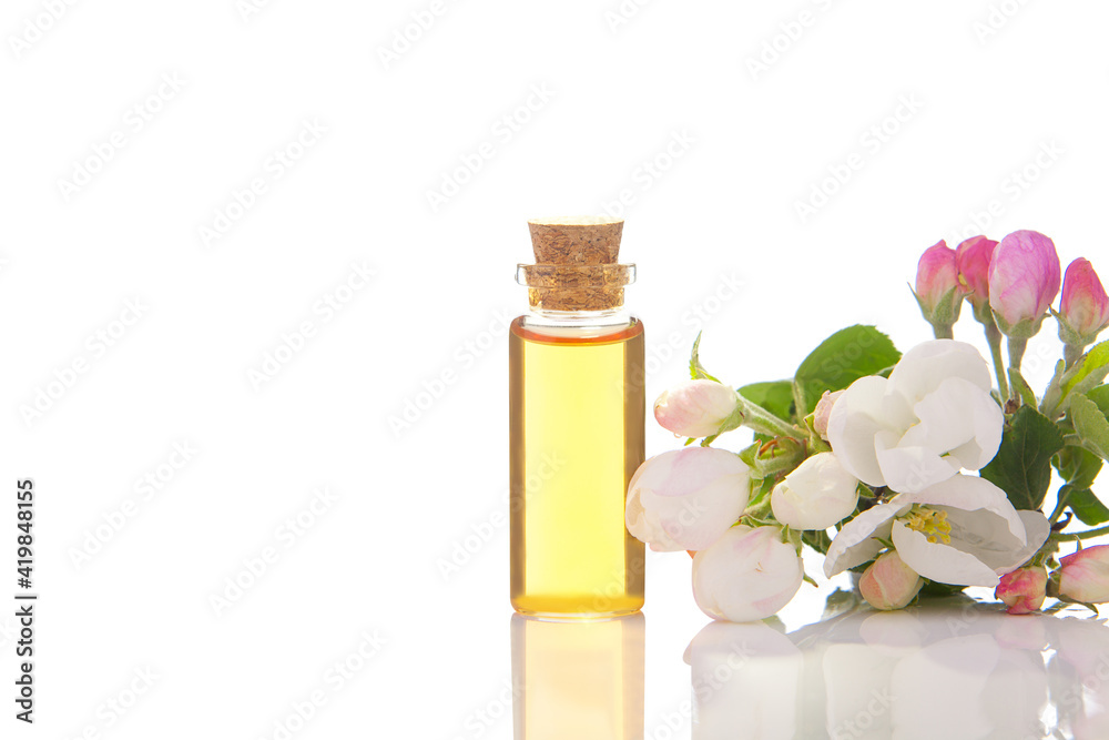 Essence of flowers on table in beautiful glass jar Essence of flowers on table in beautiful glass jar