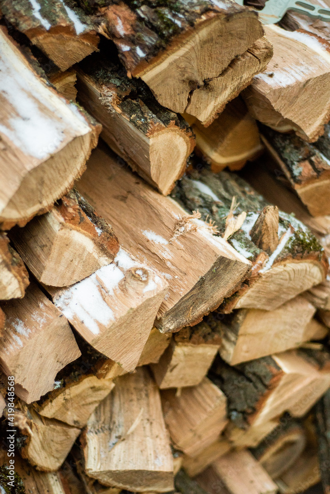 Stacks of Firewood. Preparation of firewood for the winter. Pile of Firewood.Firewood background Stacks of Firewood. Preparation of firewood for the winter. Pile of Firewood.Firewood background