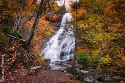 Canvas Print Close up of high waterfall river in autumn season