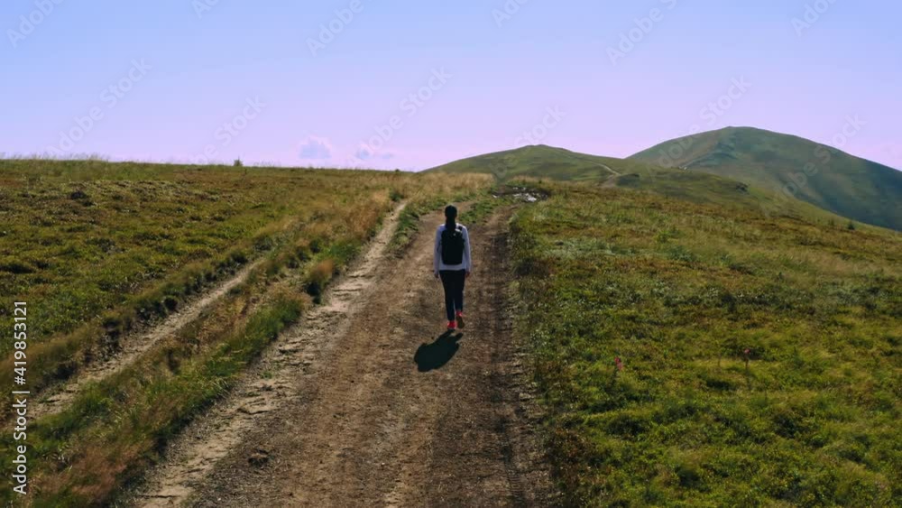 drone flies above hiker path in valley active lifestyle travel and adventure drone flies above hiker path in valley active lifestyle travel and adventure