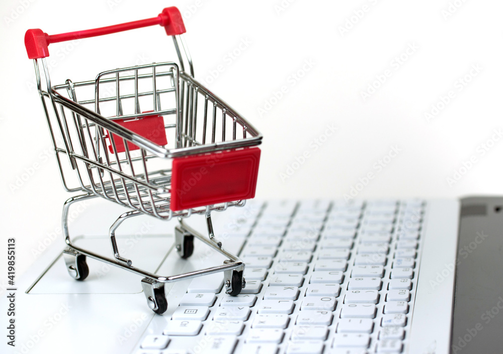 the shopping cart on the laptop keyboard, concept online shopping