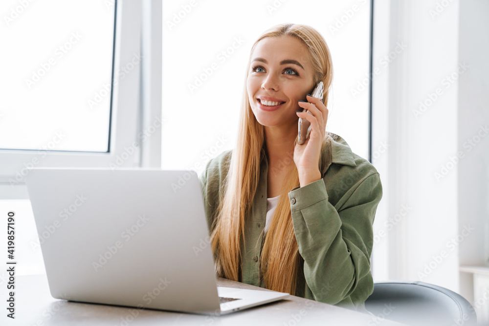 Happy smiling attractive young woman with laptop computer Happy smiling attractive young woman with laptop computer