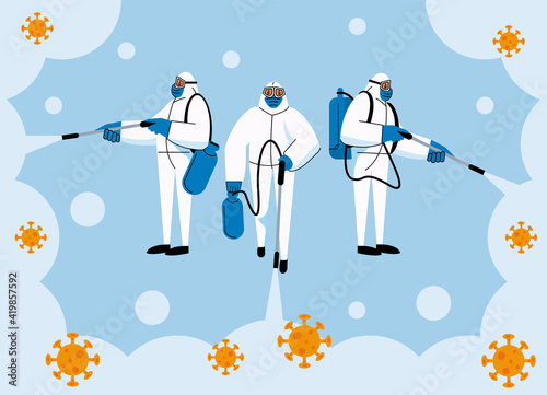 three workers disinfecting