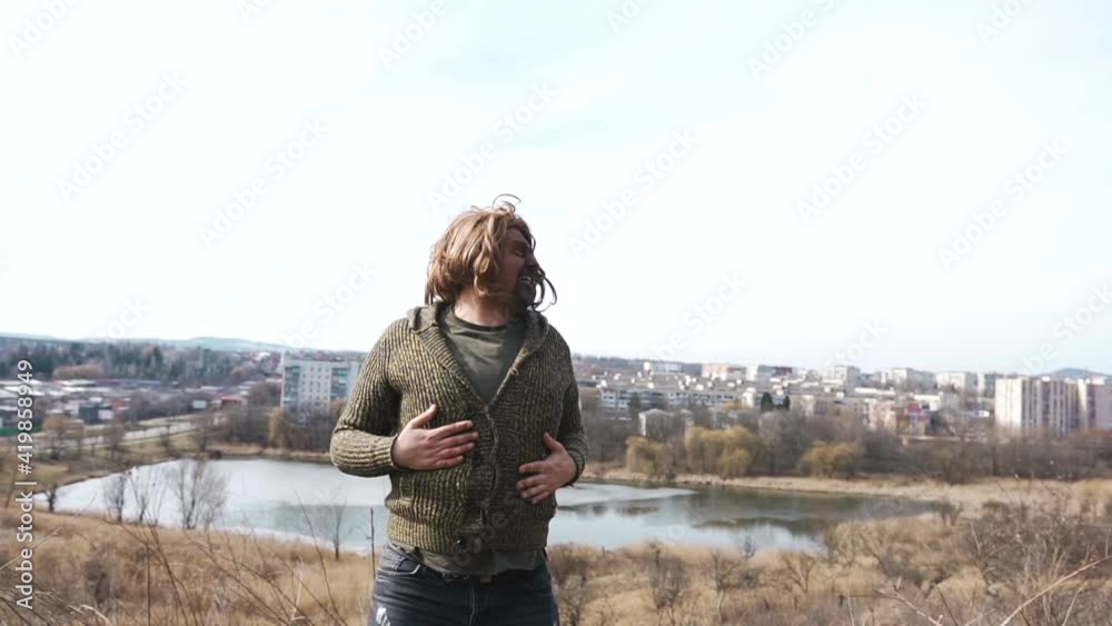 A white man with dark paint on his face and in a wig fools and dances on the field and beats himself on the ass A white man with dark paint on his face and in a wig fools and dances on the field and beats himself on the ass