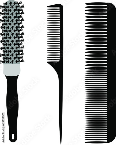 Hairdressing combs. A barber's tool. Combs for hair styling. Set of combs and brushes for hairdressing.