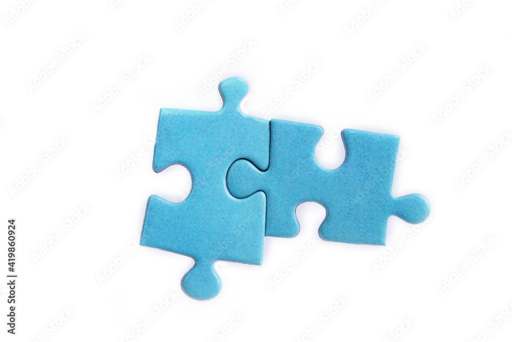 Puzzles on a white background. Solution and teamwork concept Puzzles on a white background. Solution and teamwork concept