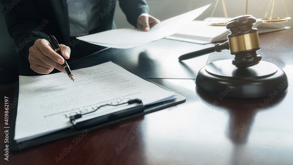 udge gavel with Justice lawyers having team meeting at law firm background. Concepts of Law and Legal services. udge gavel with Justice lawyers having team meeting at law firm background. Concepts of Law and Legal services.