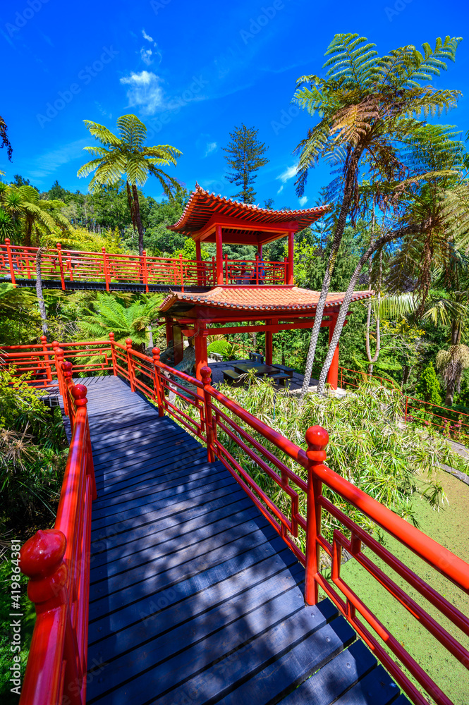 Monte Palace - Tropical Garden with Waterfalls, Lakes and traditional buildings above the city of Funchal - popular tourist destination in Madeira island, Portugal. Monte Palace - Tropical Garden with Waterfalls, Lakes and traditional buildings above the city of Funchal - popular tourist destination in Madeira island, Portugal.