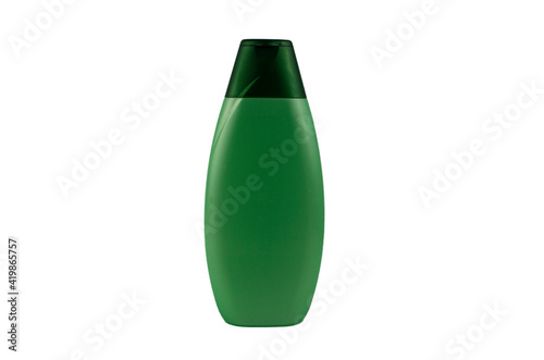 Green plastic bottle of po shampoo on a white background.