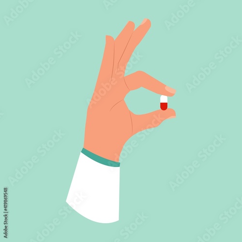 Hand holding a medical pill. Doctor's hand is holding a red and white pill his fingers.Vector illustration