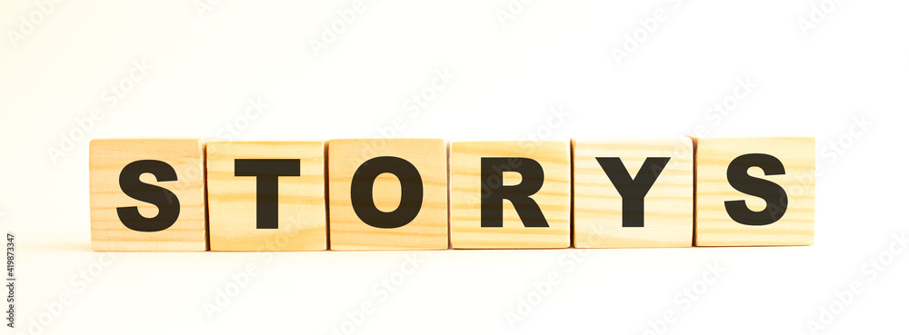 The word STORYS. Wooden cubes with letters isolated on white background. The word STORYS. Wooden cubes with letters isolated on white background.