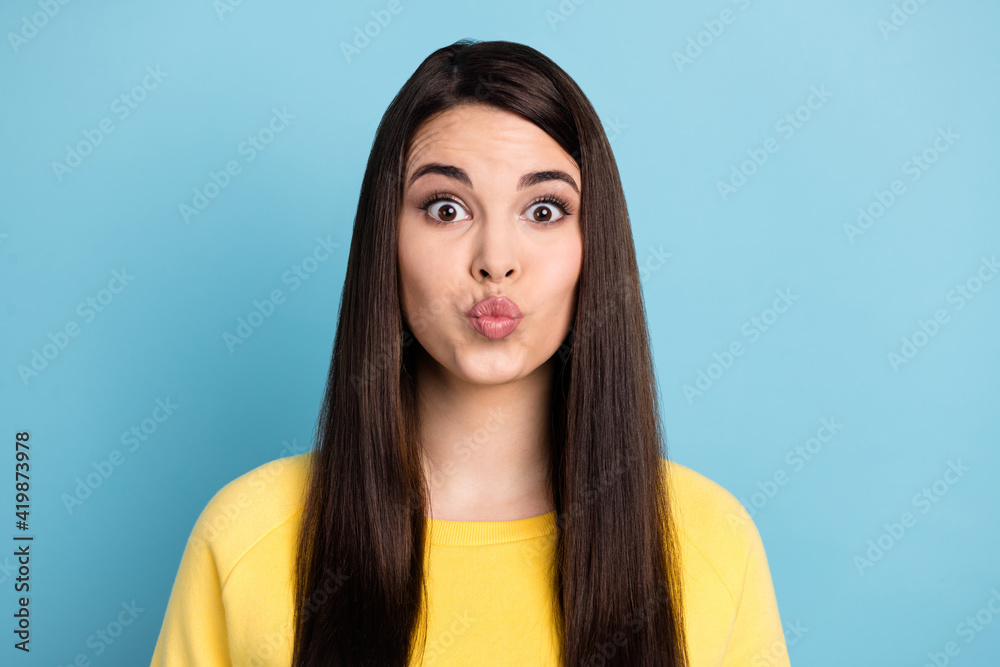 Portrait of nice optimistic brunette long hairdo lady blow kiss wear yellow shirt isolated on bright blue color background