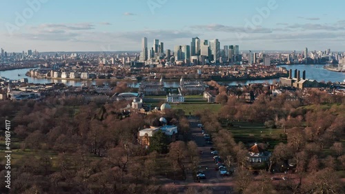 Dolly forward aerial drone shot of Greenwich observatory university towards Canary wharf skyscrapers photo