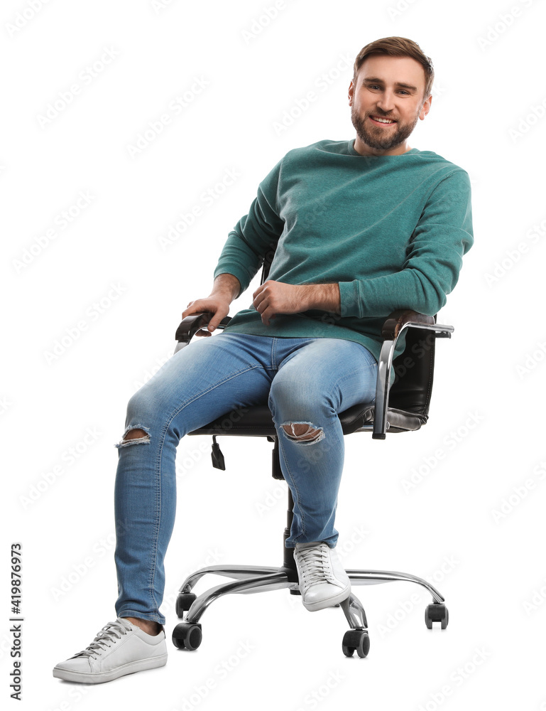Young man sitting in comfortable office chair on white background Young man sitting in comfortable office chair on white background