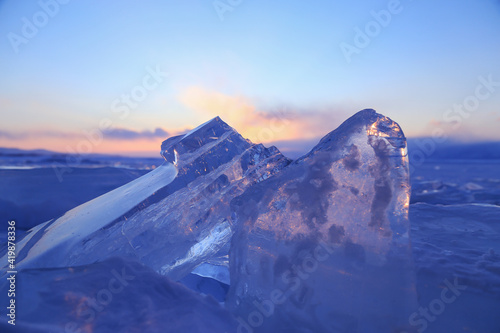 Blue ice of Baikal Lake  sunset scene