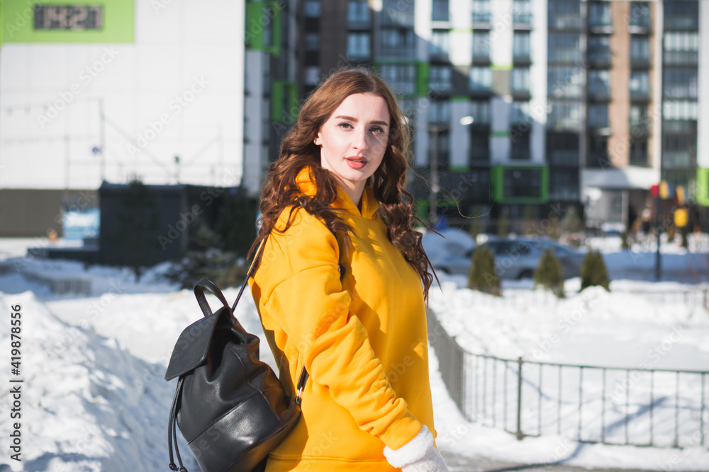 Beautiful and stylish Russian girl model in winter on the street of Moscow