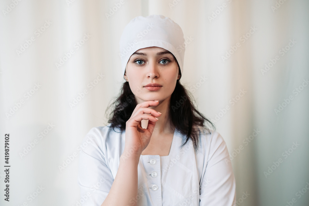 Nurse young medic standing near white wall and looking at the camera. Female doctor dressed in medical gown and surgical hat. Image with copy space. Pandemic virus coronavirus concept
Nurse young medic standing near white wall and looking at the camera. Female doctor dressed in medical gown and surgical hat. Image with copy space. Pandemic virus coronavirus concept