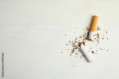 Bild auf Leinwand Broken cigarette on white table, flat lay with space for text