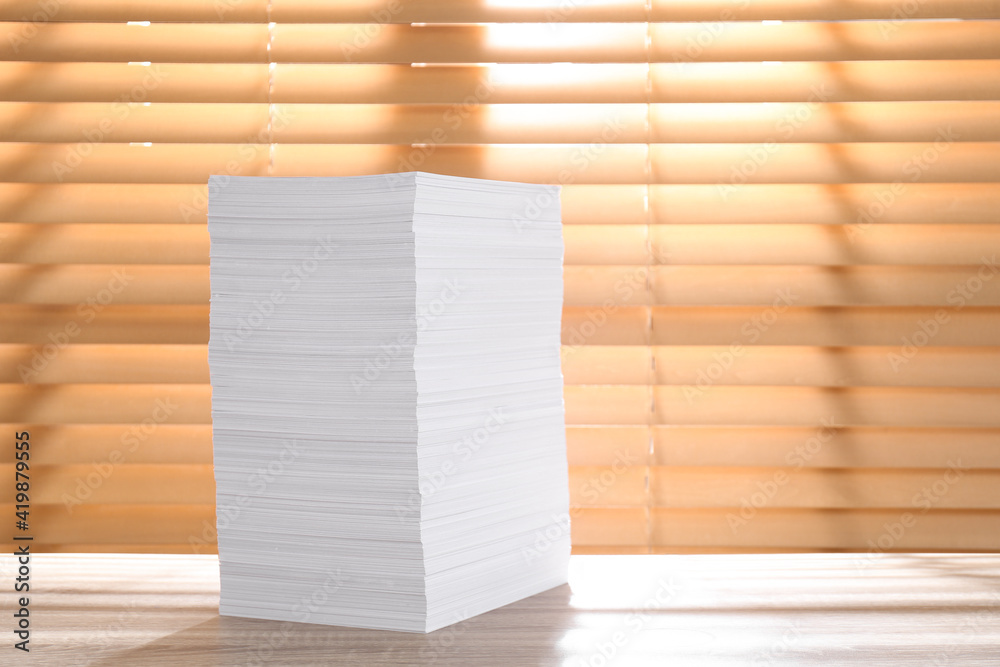 Stack of paper sheets on wooden table. Space for text Stack of paper sheets on wooden table. Space for text