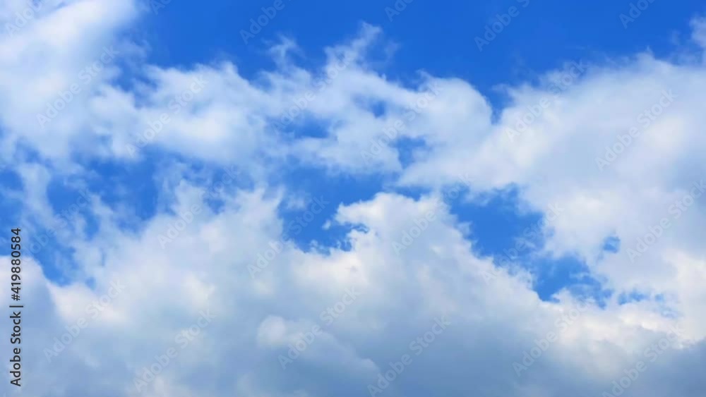 White cloud floating timelapse in the summer blue sky White cloud floating timelapse in the summer blue sky