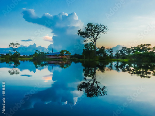 The cloud formations after a storm in the amazon rainforest are amazing and unique. The reflections in the water are an artistic masterpiece.. © Chris
