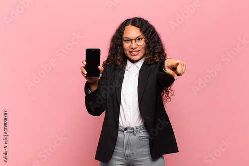 young pretty hispanic woman business and smartphone concept