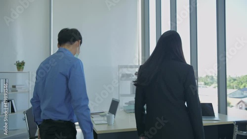 Business concept of 4k Resolution. Employees are greeting each other by hitting elbows in the office. photo