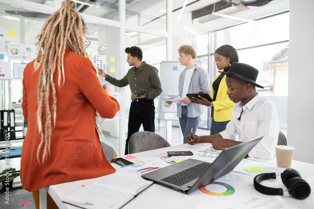 Creative students analysing business strategy of project Creative students analysing business strategy of project