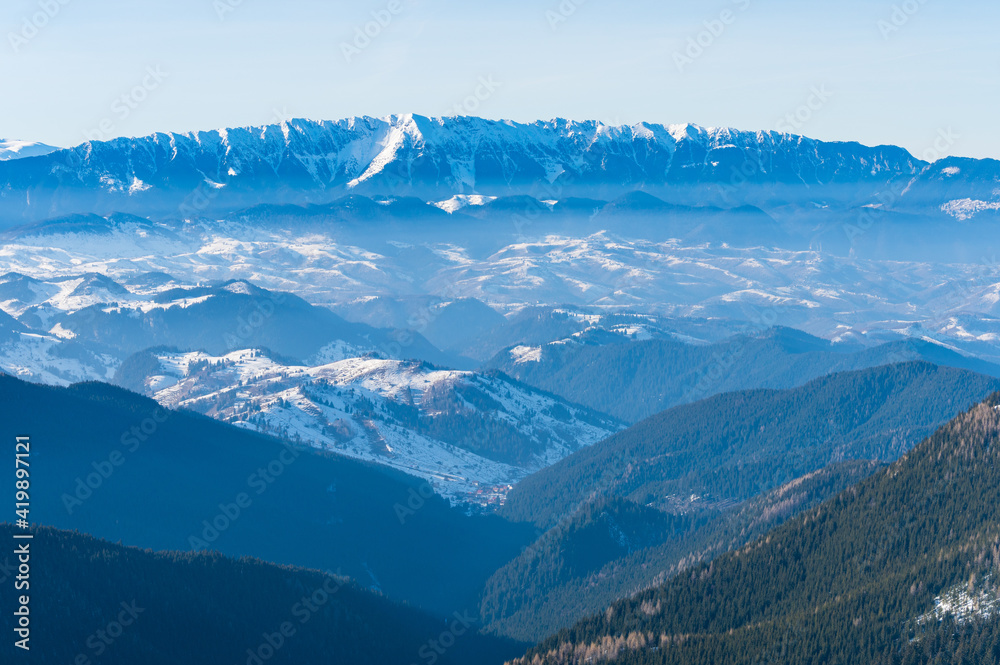 View over Piatra Craiului mountain range in Romania in winter