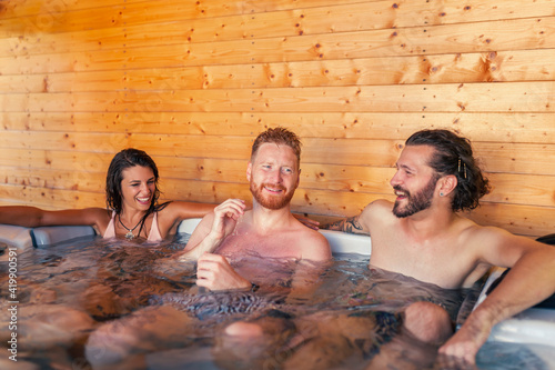 Friends relaxing in a spa center hot tub