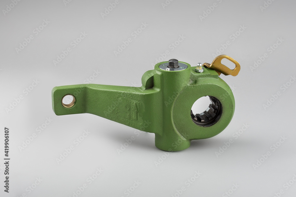 Slack adjuster.Brake slack adjuster on the gray background. Truck parts. Car parts. Parts on the gray background. Ratchet. Slack adjuster.Brake slack adjuster on the gray background. Truck parts. Car parts. Parts on the gray background. Ratchet.