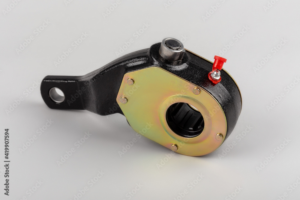 Slack adjuster.Brake slack adjuster on the gray background. Truck parts. Car parts. Parts on the gray background. Ratchet. Slack adjuster.Brake slack adjuster on the gray background. Truck parts. Car parts. Parts on the gray background. Ratchet.