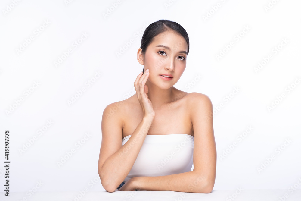 Young Beautiful Asian Woman with Clean Fresh Skin on white background. Beautiful young woman close up face with clean skin isolated on white. Portrait of beauty face woman natural healthy skin. Young Beautiful Asian Woman with Clean Fresh Skin on white background. Beautiful young woman close up face with clean skin isolated on white. Portrait of beauty face woman natural healthy skin.