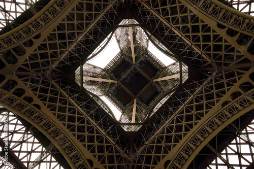 A view of the Eiffel Tower from below in Paris in summer.