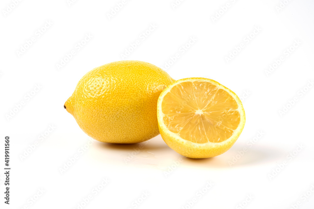 A whole and half lemons isolated on white background A whole and half lemons isolated on white background