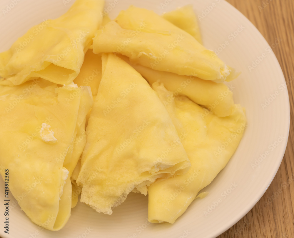 Homemade sweet and tasty pancakes with cheese close up