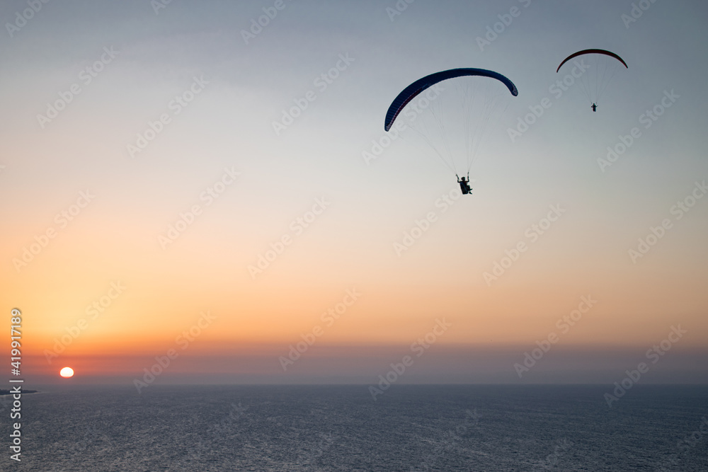 Parachuting - Paragliding in sunset Parachuting - Paragliding in sunset