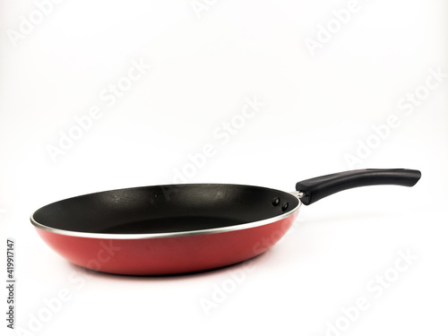 Frying pan isolated with white background. Selective focus.