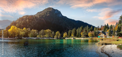 Fototapeta Naklejka Na Ścianę i Meble -  Wonderful nature scenery in Slovenian Alps. Incredible autumn view on Jasna lake. Triglav national park. Kranjska Gora, Slovenia. Amazing vibrant landscape with mountain lake and colorful sky