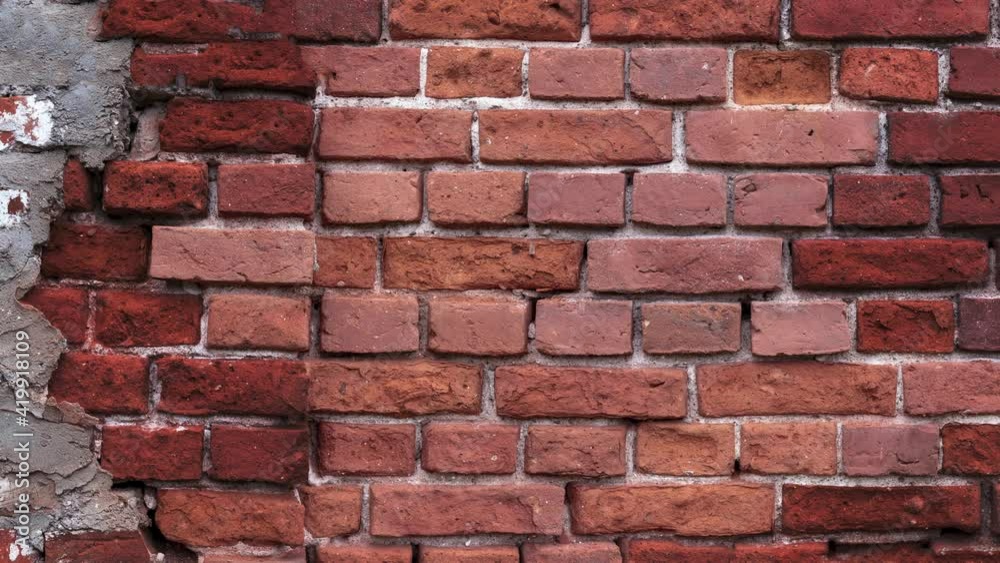 old brick wall as texture background in slow motion. Brick wall screensaver, transition start and end old brick wall as texture background in slow motion. Brick wall screensaver, transition start and end