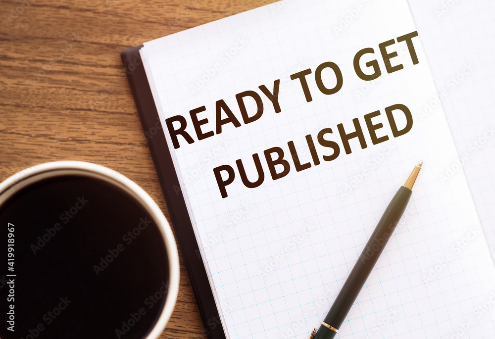 READY TO PUBLISHED - text on notepad on wooden desk. READY TO PUBLISHED - text on notepad on wooden desk.